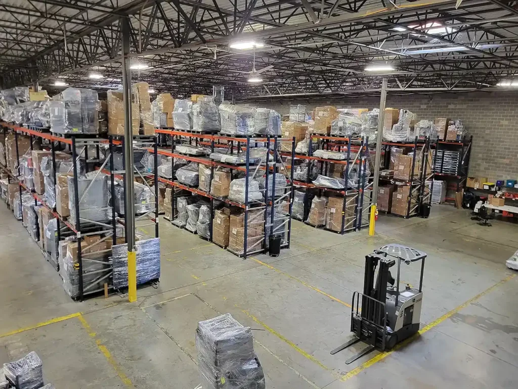 A warehouse with boxes and forklifts