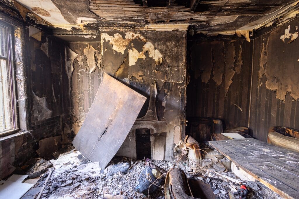 a building with major fire damage and smoke stains in need of fire damage restoration