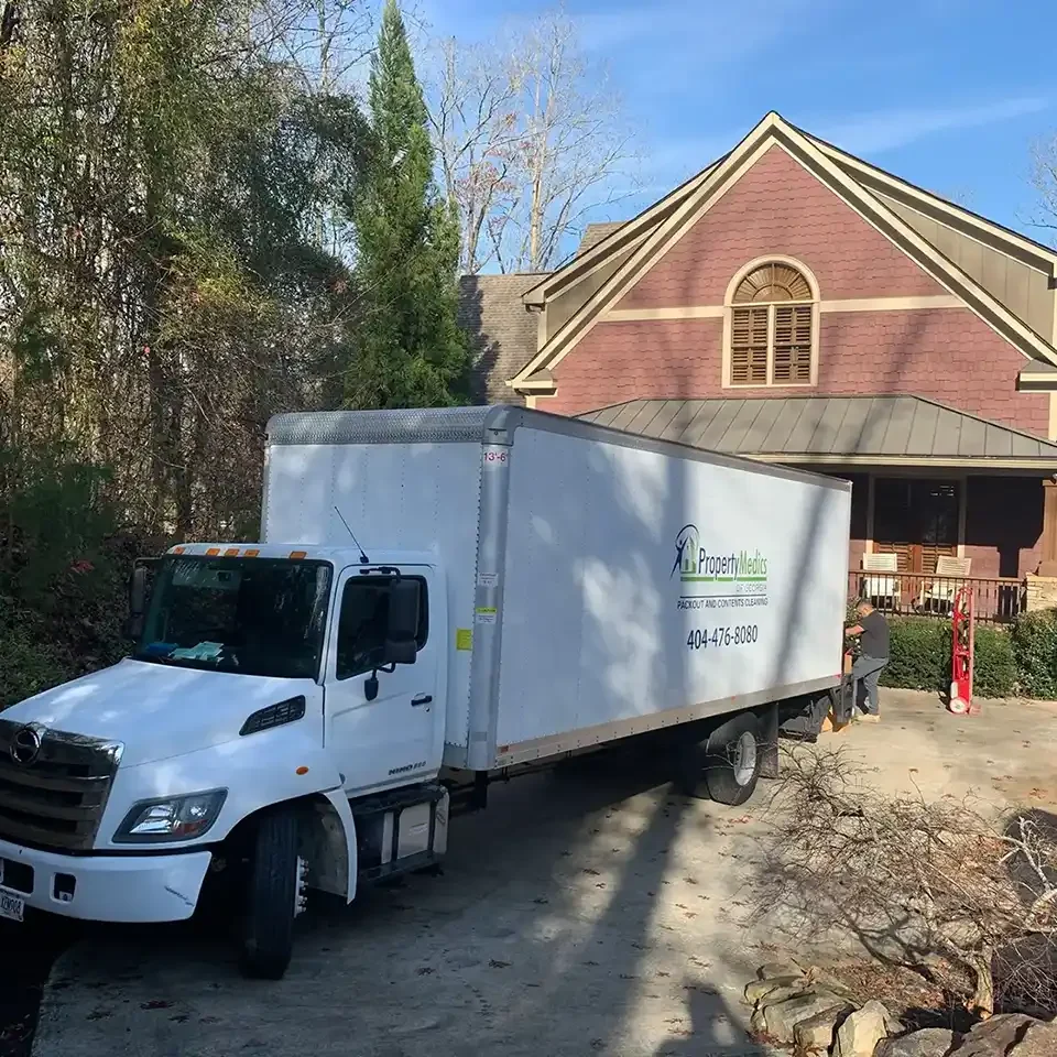 A Property Medics truck in front of a house